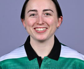 Shamrock Rovers football player smiling in team jersey, showcasing club badge and green-white colour.
